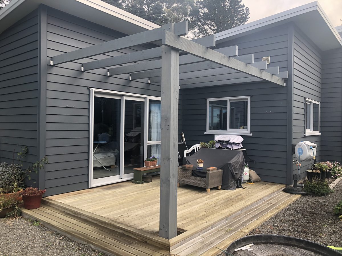 Pergola built and painted to match charcoal house, Wairarapa