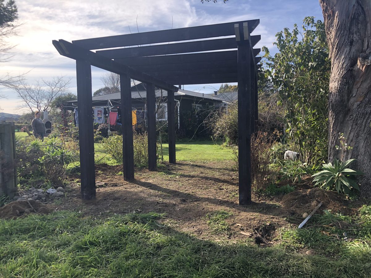 Dark timber garden pergola, side angle, Wairarapa